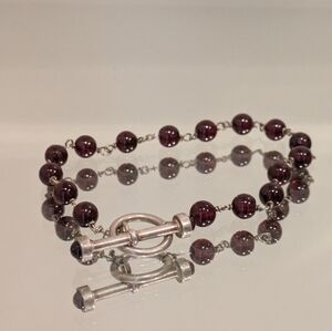 Genuine sterling silver and garnet toggle bracelet